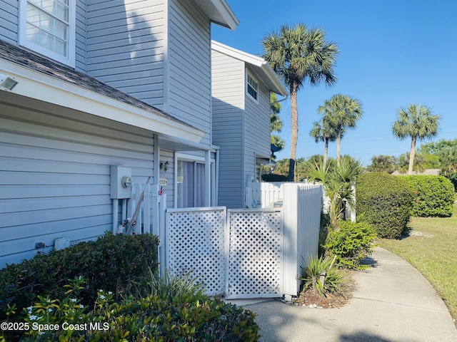 view of side of property with fence