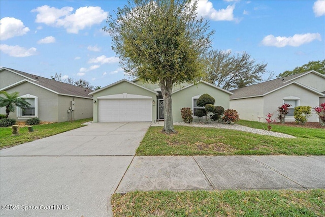 single story home with an attached garage, a front lawn, concrete driveway, and stucco siding