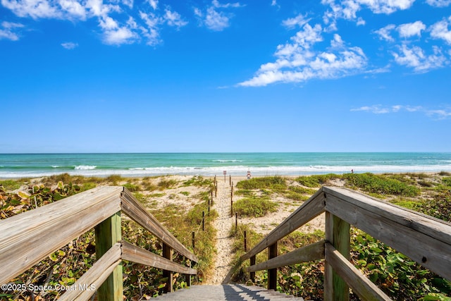 property view of water featuring a beach view