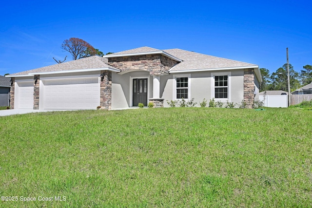 view of front of home featuring an attached garage, fence, stone siding, stucco siding, and a front yard