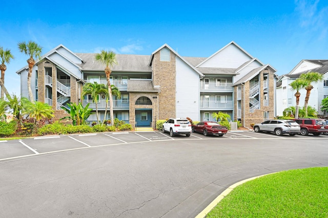 view of property featuring uncovered parking