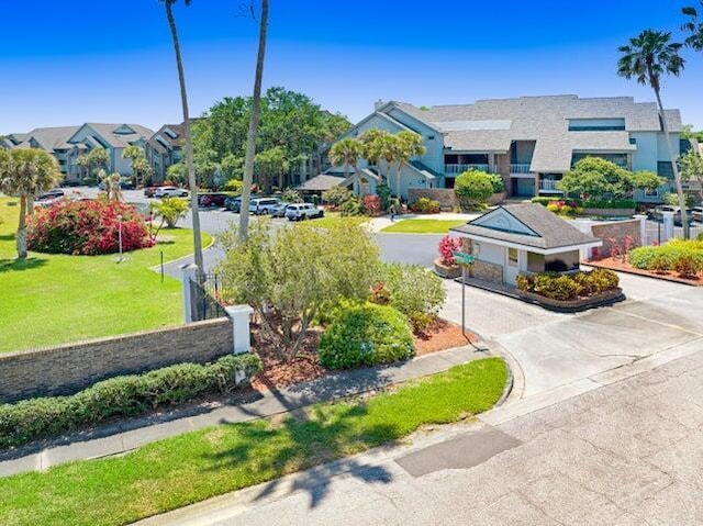 exterior space featuring a residential view and curbs