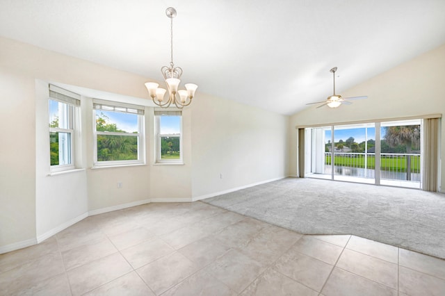 unfurnished room featuring lofted ceiling, light carpet, baseboards, and light tile patterned floors