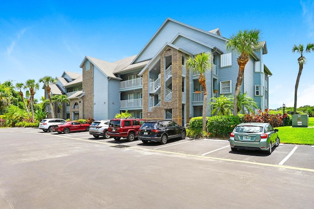 view of property featuring uncovered parking