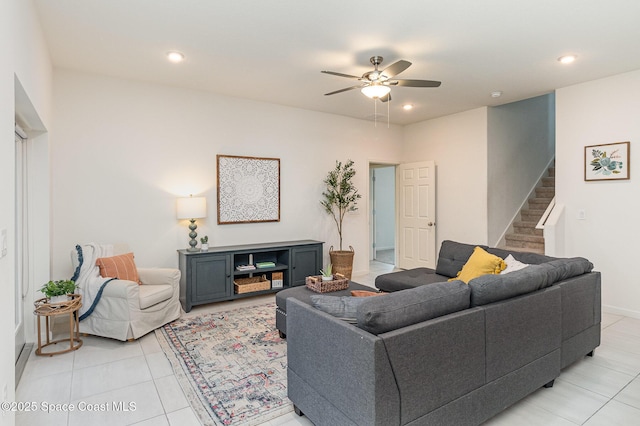 living area featuring stairs, a ceiling fan, and recessed lighting