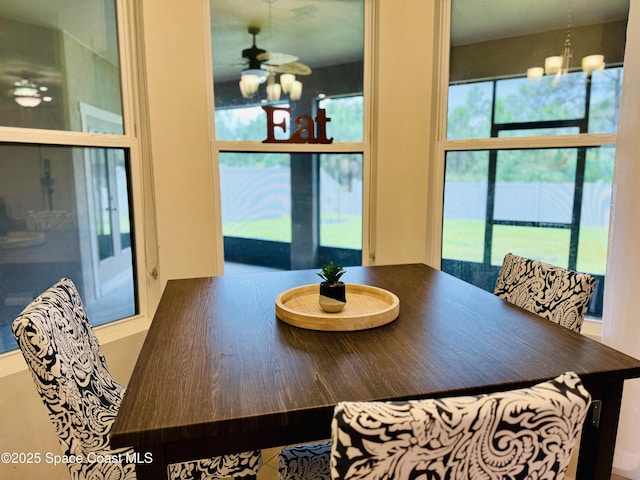 dining space with a chandelier