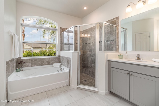 full bath with a garden tub, tile patterned flooring, a shower stall, and vanity