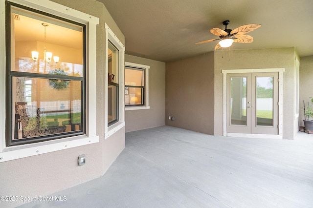 view of patio / terrace featuring ceiling fan and french doors