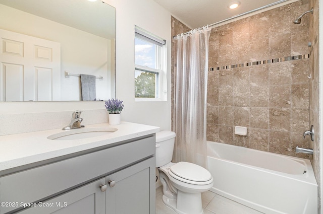 full bath with tile patterned flooring, shower / tub combo with curtain, vanity, and toilet