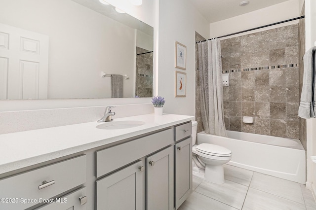 bathroom featuring toilet, shower / bath combo, vanity, and tile patterned floors