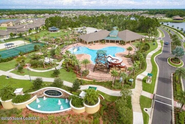 birds eye view of property with a water view