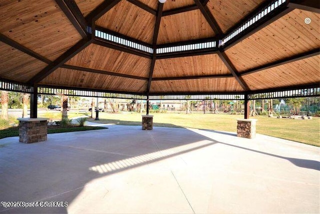 view of home's community featuring a patio area, a lawn, and a gazebo