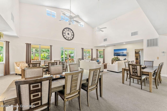 dining room featuring lofted ceiling, visible vents, ceiling fan, and carpet flooring