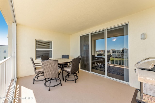 balcony featuring outdoor dining area and grilling area