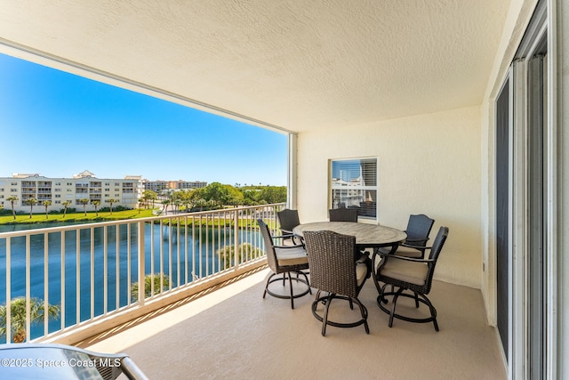 balcony featuring a water view