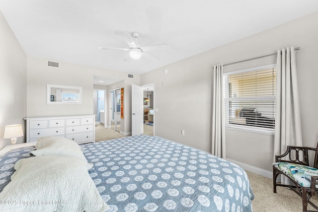 bedroom featuring light colored carpet, visible vents, and baseboards