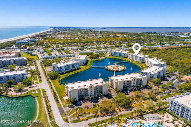 bird's eye view featuring a water view and a city view