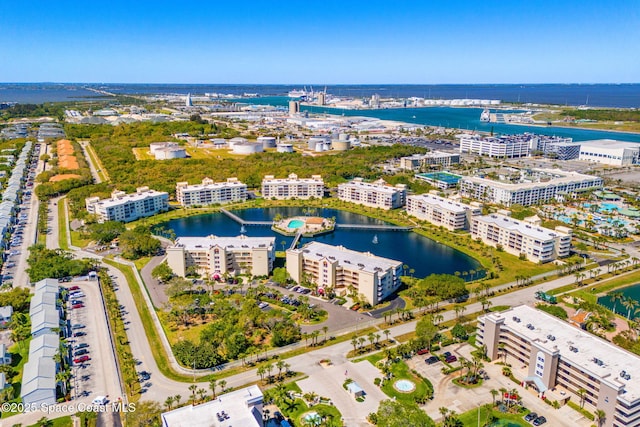 drone / aerial view with a view of city and a water view