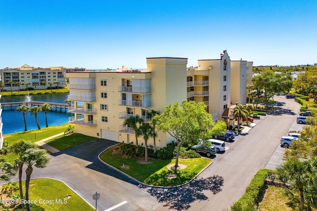 view of building exterior with a water view