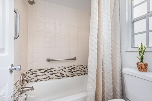 full bath featuring shower / tub combo and toilet