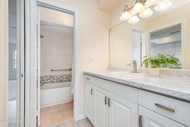 full bathroom featuring  shower combination, tile patterned flooring, and vanity