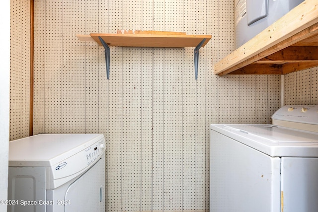 clothes washing area with laundry area and independent washer and dryer