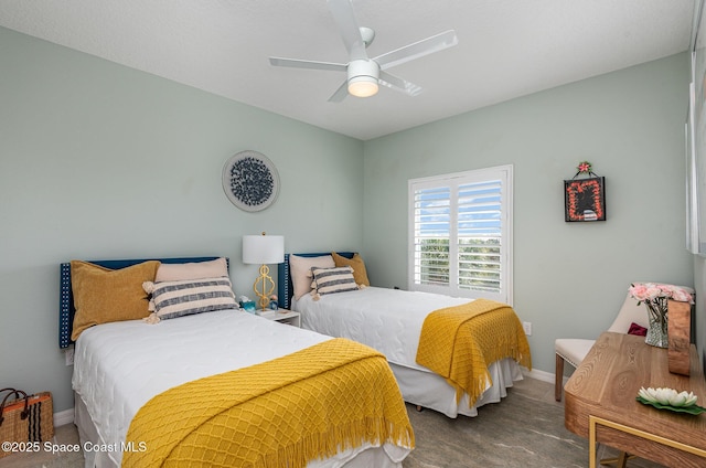 bedroom featuring ceiling fan and baseboards