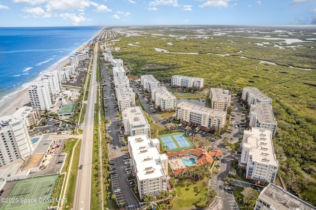 bird's eye view with a water view and a view of the beach