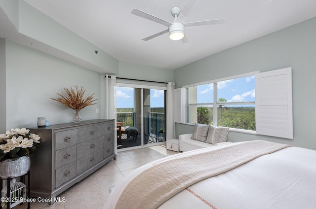 bedroom featuring access to exterior, ceiling fan, and light tile patterned floors