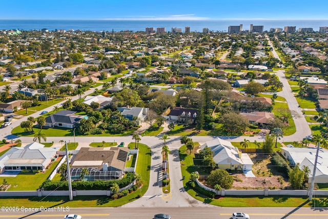 aerial view featuring a water view and a residential view