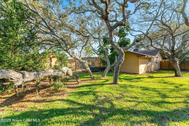 view of yard featuring fence