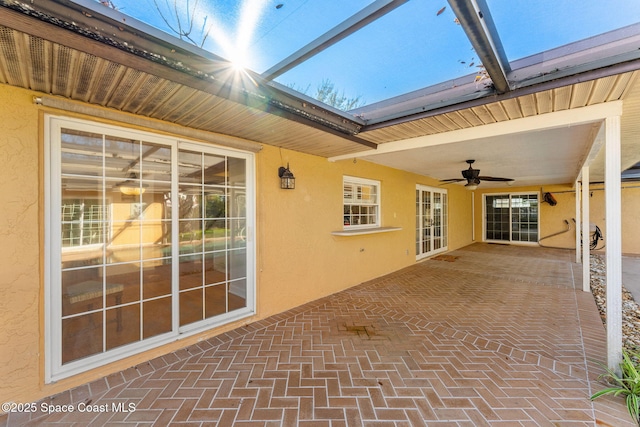 view of patio / terrace featuring a lanai and ceiling fan