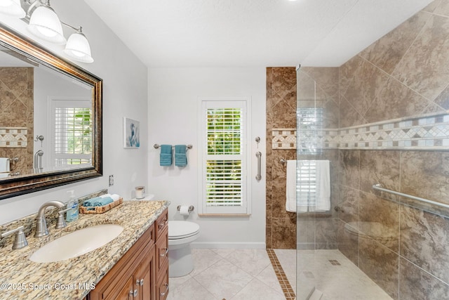 bathroom featuring a healthy amount of sunlight, baseboards, and walk in shower