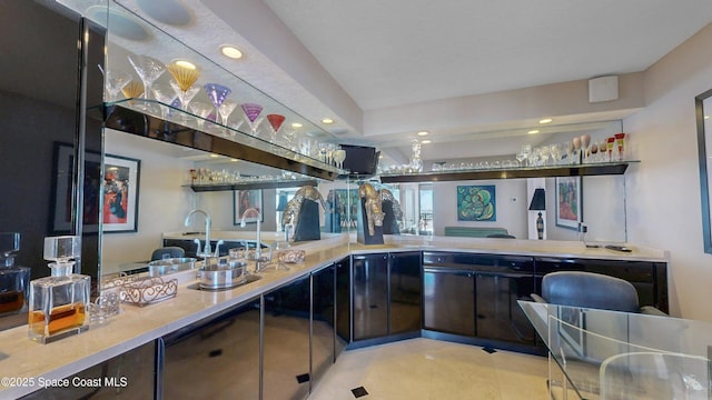 bar featuring wet bar, a sink, and recessed lighting