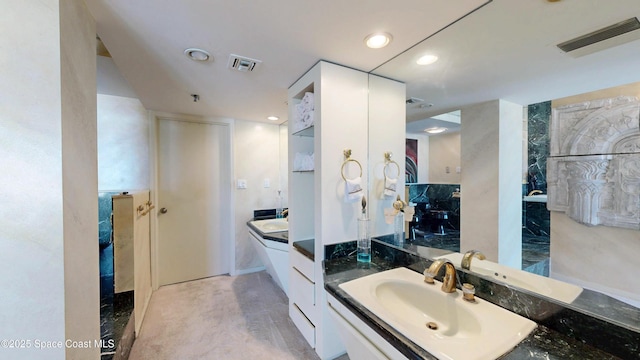 full bath featuring recessed lighting, visible vents, and vanity