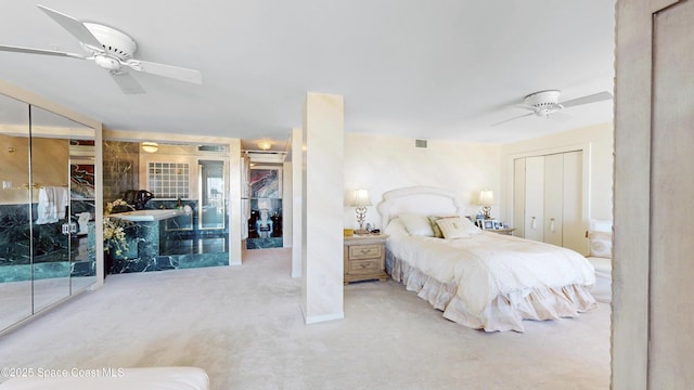 carpeted bedroom featuring visible vents and a ceiling fan