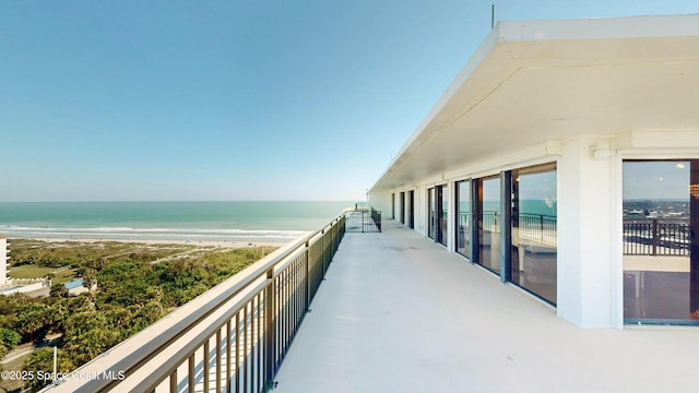 balcony with a view of the beach and a water view