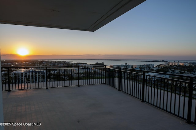 balcony at dusk with a water view