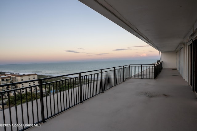 balcony at dusk with a water view