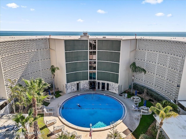 view of pool featuring a water view