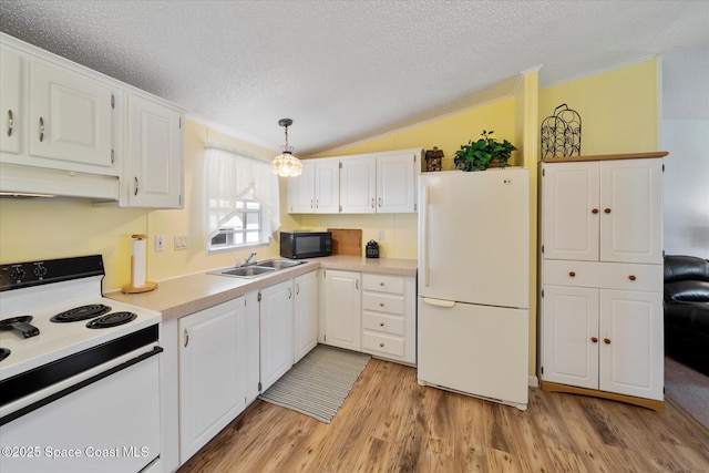 kitchen featuring white appliances, vaulted ceiling, under cabinet range hood, white cabinetry, and a sink