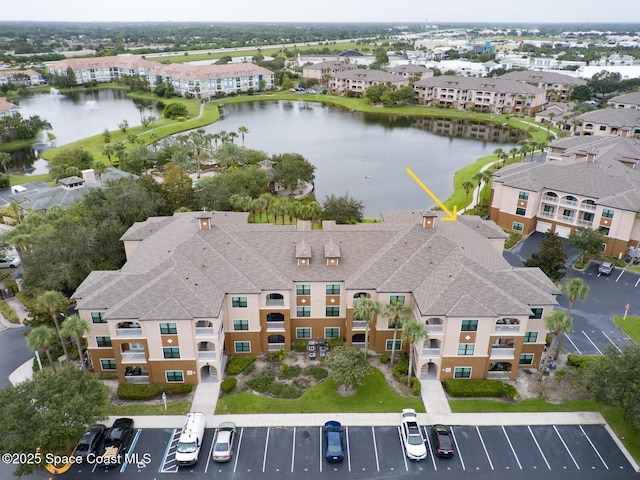 aerial view with a residential view and a water view