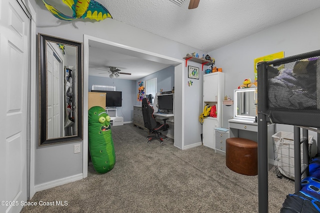 bedroom with a textured ceiling, carpet, a ceiling fan, and baseboards