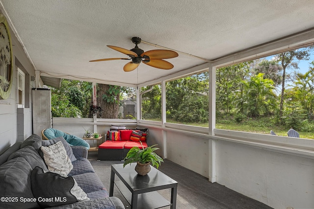 sunroom featuring a ceiling fan