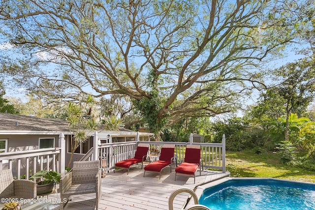 wooden terrace featuring an outdoor pool