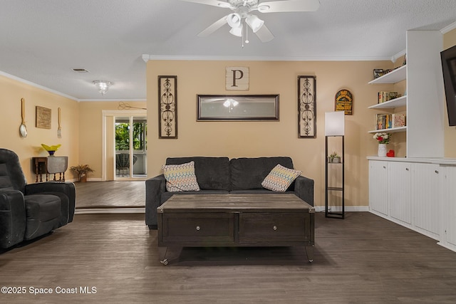 living area featuring ornamental molding, dark wood-type flooring, and visible vents