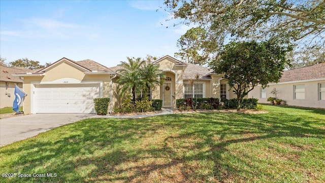 view of front facade with a garage, stucco siding, concrete driveway, and a front yard