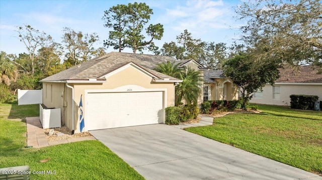 ranch-style house with a garage, a front lawn, concrete driveway, and stucco siding