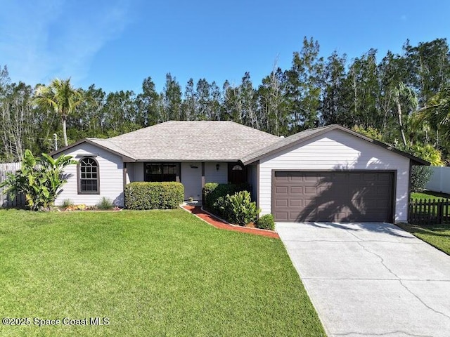 ranch-style house featuring roof with shingles, concrete driveway, an attached garage, a front yard, and fence