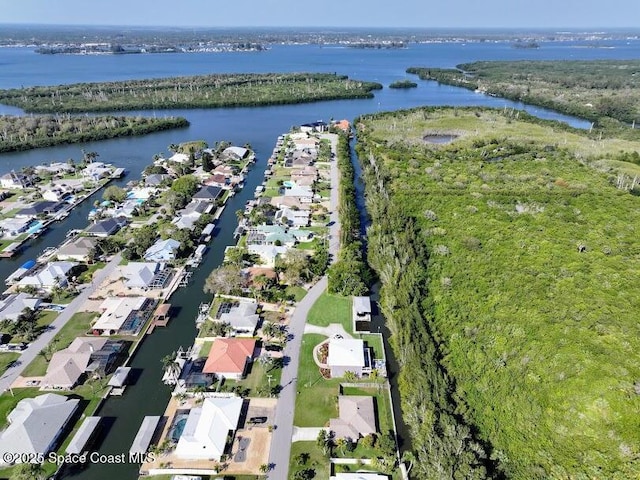 aerial view with a residential view and a water view